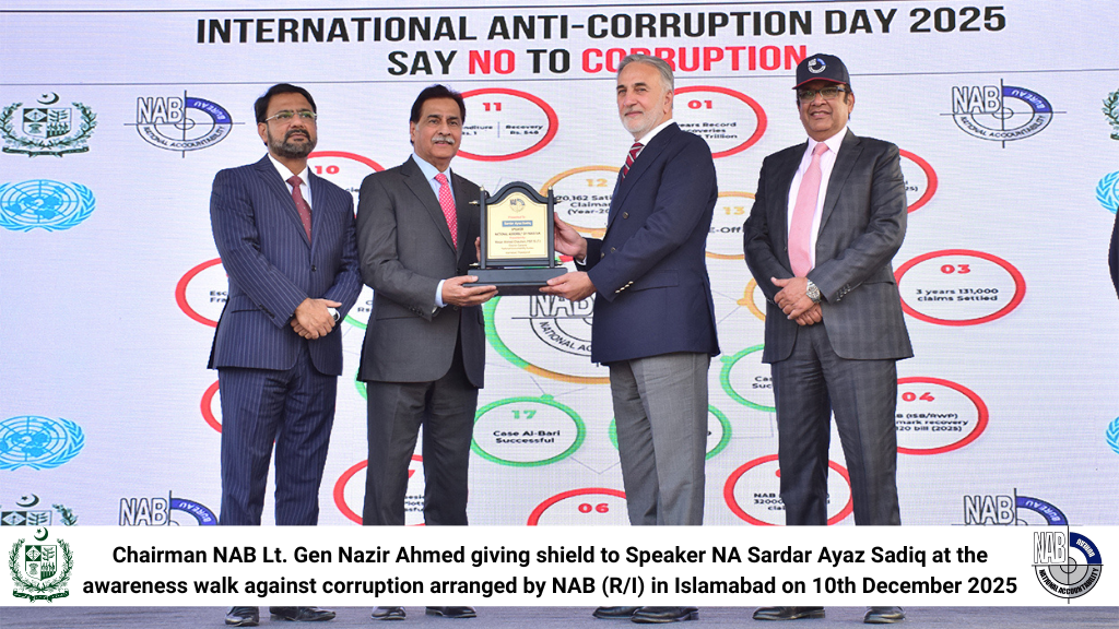 Chairman NAB Lt. Gen Nazir Ahmed giving shield to Speaker National Assembly Sardar Ayaz Sadiq at the awareness walk against corruption arranged by NAB (RI) in Islamabad on 10th December 2025